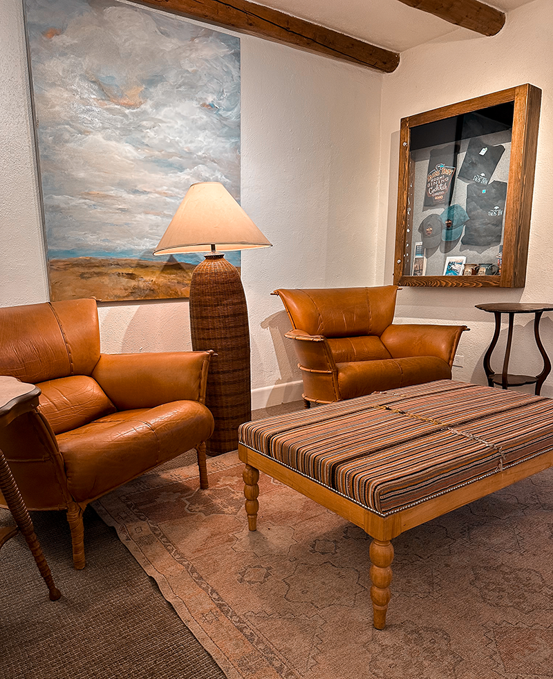 Cozy leather seating in Taos Inn library