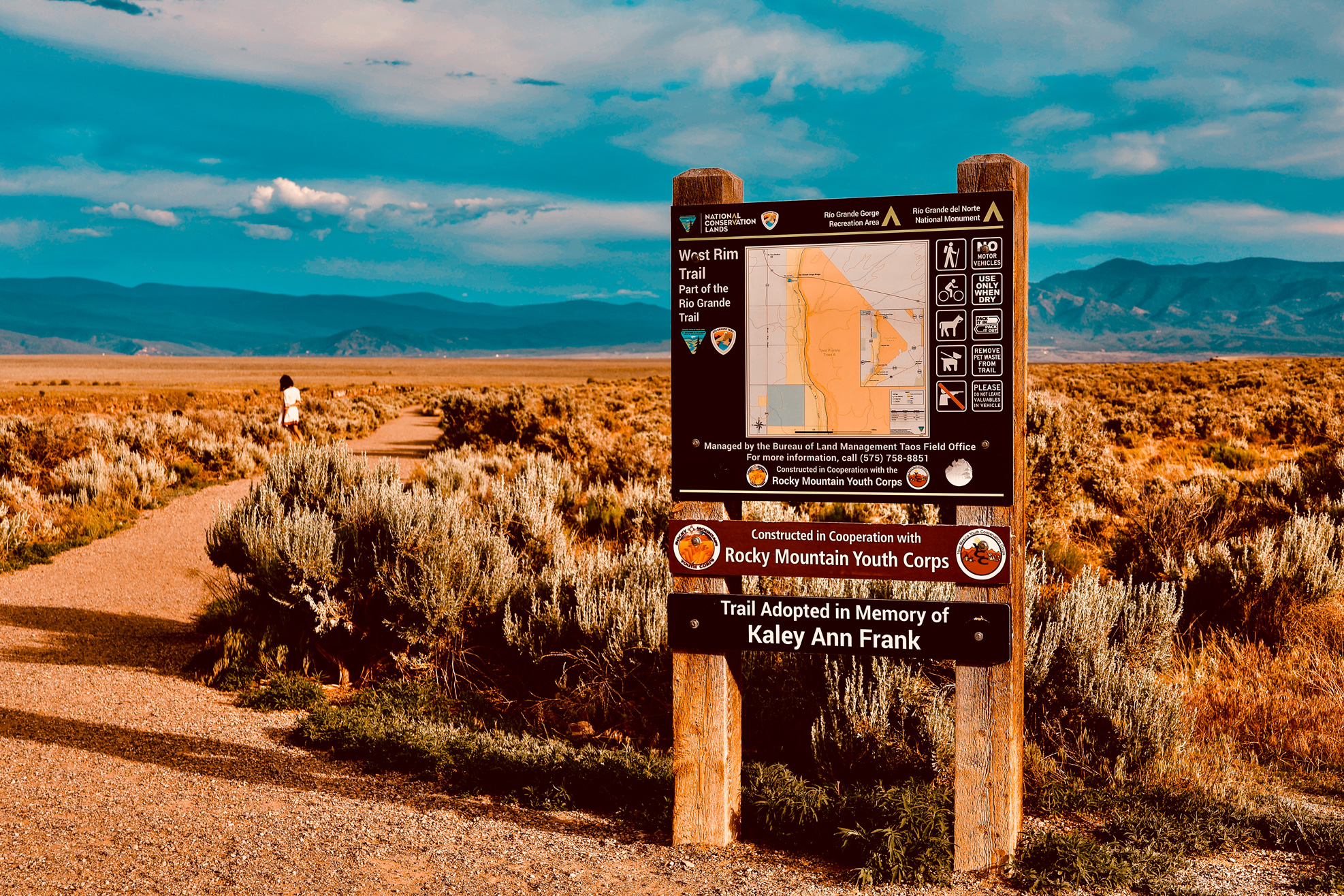 Rio Grande Trail map at sunset with mountains in the background