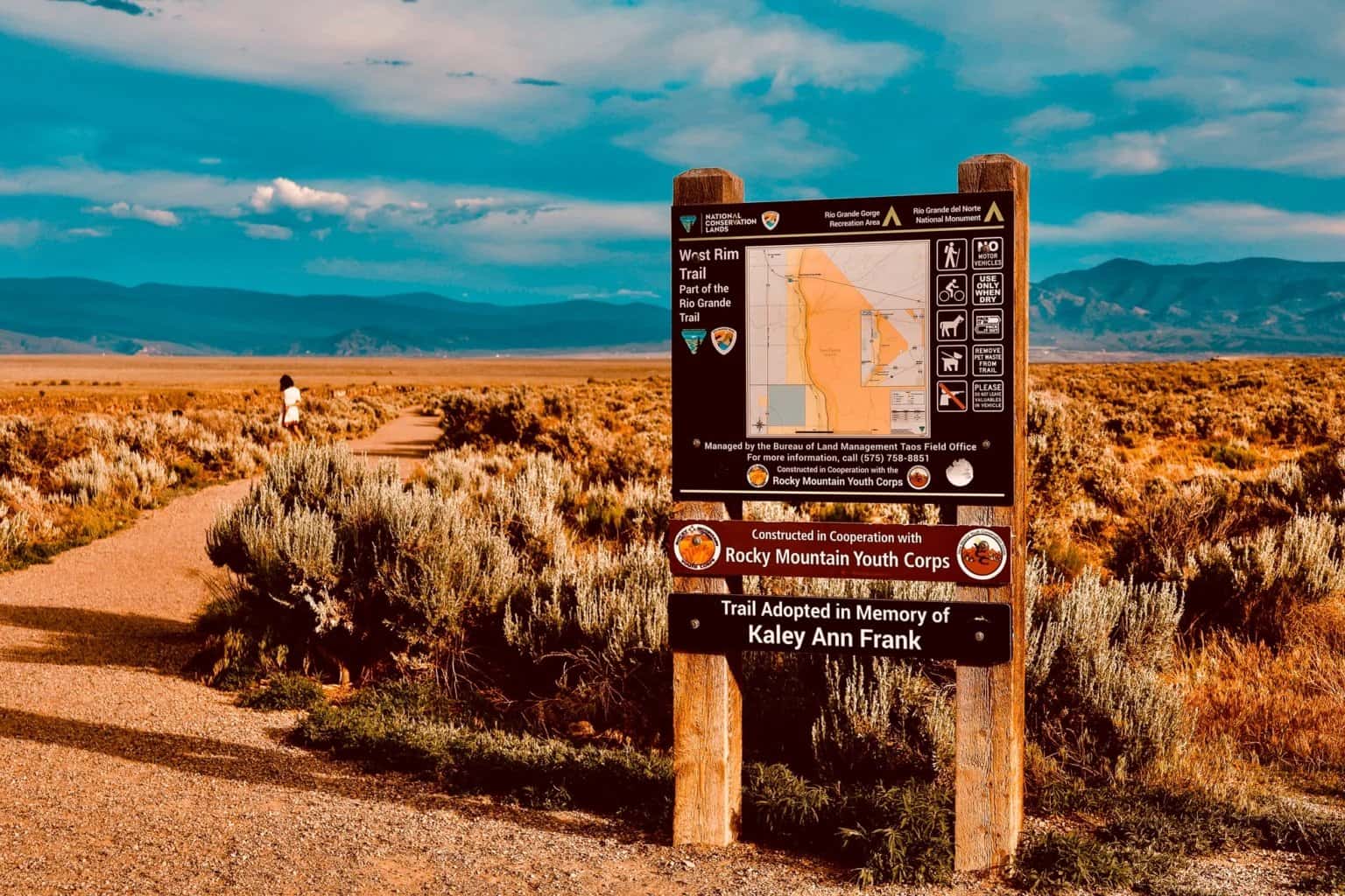 Rio Grande Trail map at sunset with mountains in the background